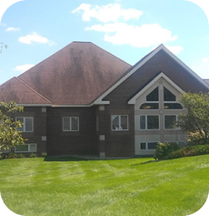 The image of a building with a dark brown roof and the same walls colors