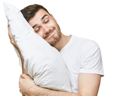 A man holding a pillow and ready to sleep