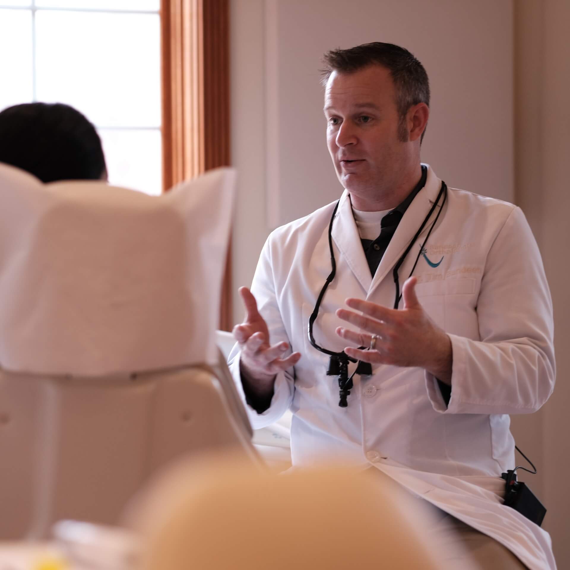 Image of a doctor speaking with patient